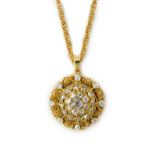 A gold and diamond set pendant, of circular form,