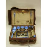 A lady's silver and pale blue enamel mounted travelling toilet set,