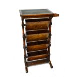 A Victorian figured walnut reading stand with fold out top over four pivoting compartments,