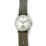 A gentleman;'s steel circular cased Omega wristwatch, the signed circular silvered dial,