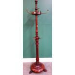 A Victorian turned mahogany coat and hat stand, on paw feet, 175cm high.