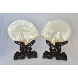 A pair of Chinese carved mother-of-pearl shells on stands, 19th century,