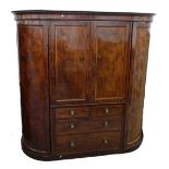 A Victorian inlaid mahogany double bowfront compactum wardrobe on plinth base,