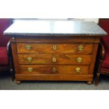 An early 19th century French fruitwood commode, with marble top over four long drawers,