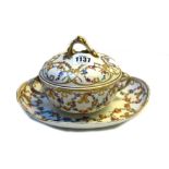 A Sevres style two handled bowl, cover and stand, 19th century, decorated with gilt flowers,