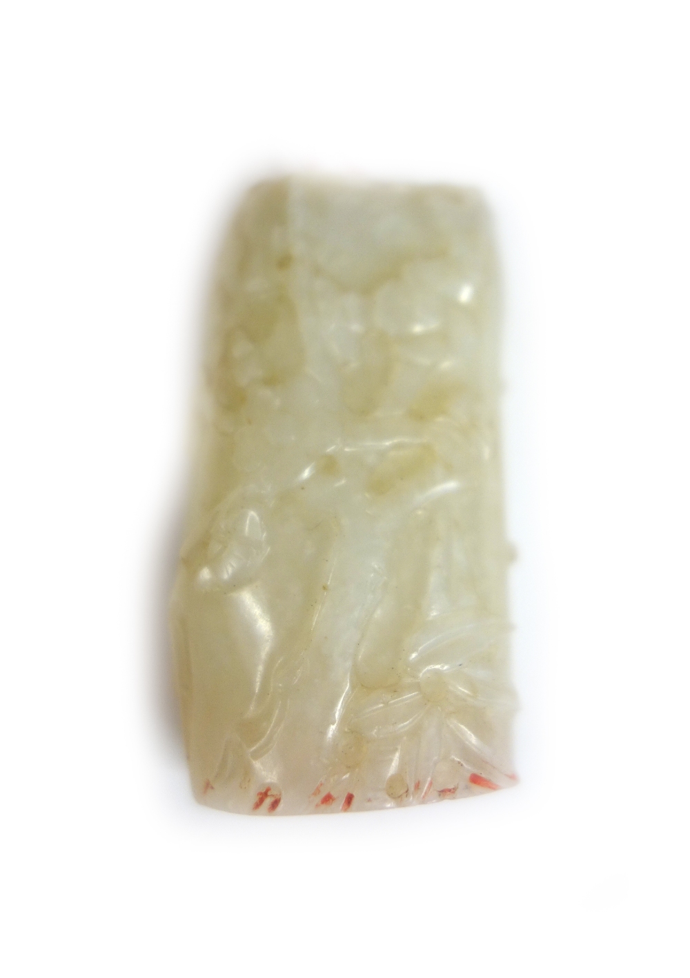 A Chinese white jade seal, 19th/20th, carved with a pine tree and flowering prunus,