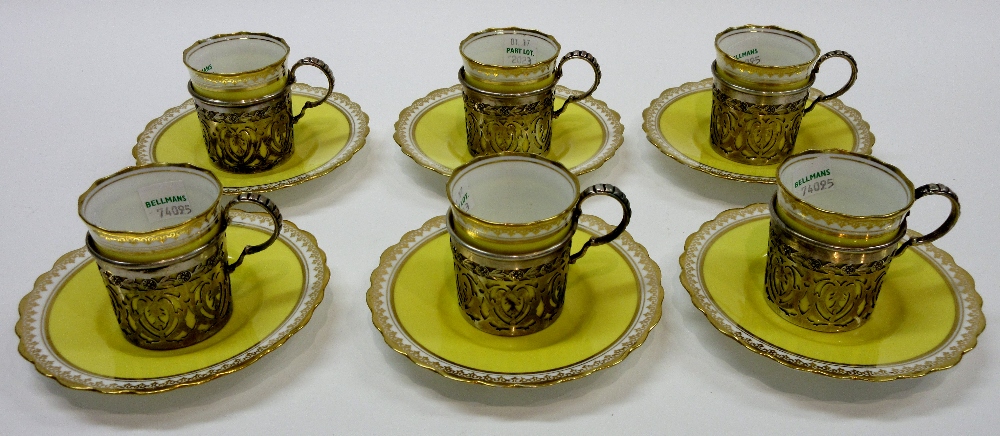 A set of six Aynsley porcelain coffee cups and saucers,