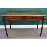 A Victorian mahogany two drawer writing table, on turned supports, 126cm wide x 61cm deep.