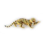 A gold and enamelled brooch, modelled as a tiger, the eyes mounted with circular cut diamonds,