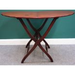 A George III mahogany oval folding coaching table, 68cm x 110cm.