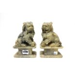 A pair of Chinese soapstone figures of temple dogs, late 19th/20th century,