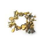 A 9ct gold bracelet, fitted with a variety of 9ct gold, silver and other charms,