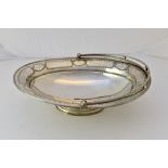 A Victorian silver cake basket, of oval form, decorated with a bar pierced and beaded border,