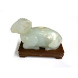 A Chinese pale celadon jade carving of a recumbent ram, 20th century,