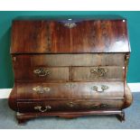 An early 19th century Dutch mahogany stepped and welled bombe shaped bureau,