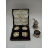 A set of four Victorian silver salts, each of scallop shell form, raised on three feet,