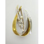 A 14ct yellow and white gold, diamond and cultured pearl set brooch, in a scrolling abstract design,