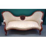 A Victorian carved and pierced walnut spoon back sofa, on scroll supports, 194cm wide x 86cm high.