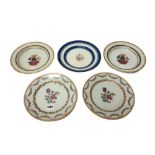 A pair of Chinese famille-rose plates, Qianlong, each painted with central flowers,