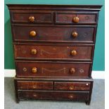 A mid-18th century oak chest on stand, with two short and three long graduated drawers,