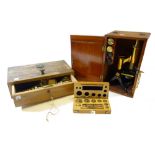 A Victorian mahogany cased microscope, with two eyepieces and a cased objective,