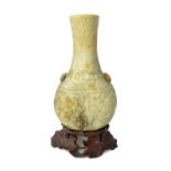 A Chinese grey, russet and black jade vase, Ming dynasty, of flattened bottle form,