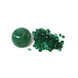 One unmounted large cabochon emerald and a quantity of unmounted faceted small emeralds,