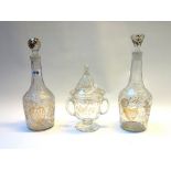 A pair of French glass decanters and stoppers, circa 1900, gilt engraved with love hearts,