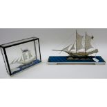 Two Javanese filigree models of twin masted sailing boats, with stands,