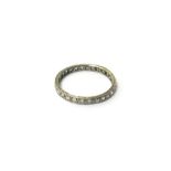 A diamond set full eternity ring, mounted with small cushion shaped diamonds,