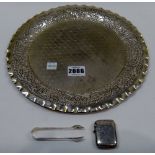 A foreign circular dish, the centre decorated in a honeycomb design, on a textured ground,