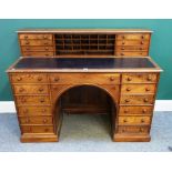 A Victorian mahogany and walnut kneehole writing desk with fitted superstructure,