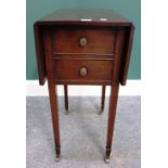 A George III mahogany deception drop flap table, with four faux drawers, on square supports,