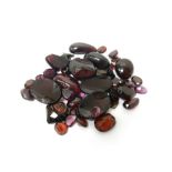 A collection of unmounted gemstones,