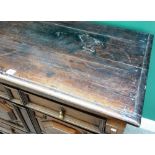 A Charles II oak two part chest of four long geometric moulded drawers, on bracket feet,