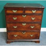 A George II mahogany banded oak chest of two short and three long graduated drawers,