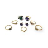 A gold ring, claw set with an oval cut synthetic corundum imitating alexandrite, detailed 9 K,