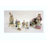 A German porcelain group modelled as a Chinaman pushing a cart,