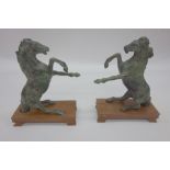 A pair of Chinese patinated bronze model