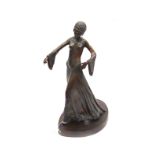 A reproduction of a 1920's bronze figure