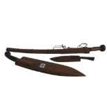 One large and one small coconut knife with steel blades and hardwood handles and sheaths,