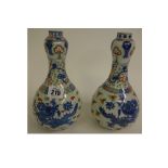 A pair of Chinese porcelain gourd shape vases, 20th century, painted in the Wucai palette,