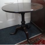 A George III mahogany tea table, the cir