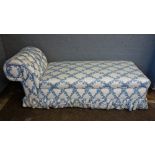 An Ottoman with button down scroll end and hinged compartment seat,