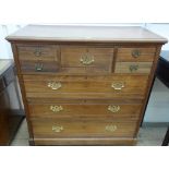 An Edwardian walnut chest of drawers, stamped 'Jas Shoolbred & Co 3993',