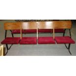 A pair of 20th century banks of four oak and metal theatre seats, (2).