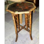 A 19th century bamboo octagonal occasional table with chinoiserie decorated top, 50cm wide.