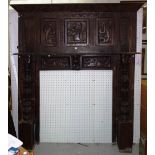 An 18th century and later large oak fire surround,