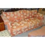 A 20th century peach and cream floral upholstered sofa,