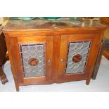 A 19th century mahogany side cabinet, with a pair of leaded stained glass doors, 104cm wide.